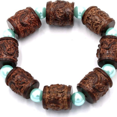 Vòng tay chuỗi hạt trụ rồng gỗ đàn hương TRNT14