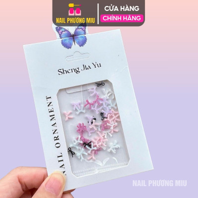 Set 50 Chiếc Charm Nơ Nhựa Nổi 3D SJY Mẫu Mới Làm Nail Siêu Xinh, Nơ Nút Thắt Ruy Băng Mix Màu Trắng Hồng Đen Size Mini Trang Trí Móng Hàn Quốc