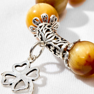 Vòng tay thạch anh mắt hổ vàng phối cỏ 4 lá Ngọc Quý Gemstones